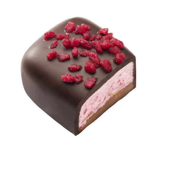 Manon Raspberry, pralină fructată și delicioasă, cremă de unt cu zmeură, așezată delicat  pe un strat de cremă pralinată crocantă. Toată acoperită cu ciocolată neagră și presărată cu bucăți de zmeură