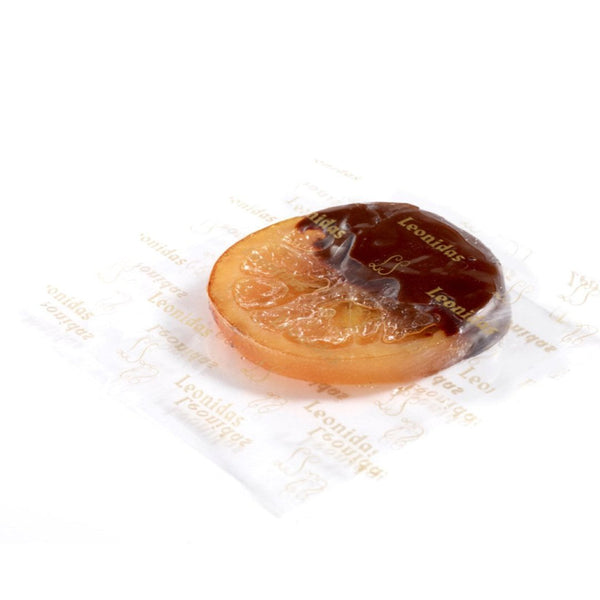 OrangeTrempée - esența combinației acrișor-dulce este o felie de portocală de Valencia în suc propriu, învelită pe jumătate în ciocolată neagră Leonidas