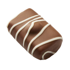  Manon Nougatina,o pralină senzuală cu cremă de unt cu alune de pădure, cremă pralinată și o perlă crocantă de nugatină, învelită în ciocolată cu lapte cu dungi de ciocolată albă