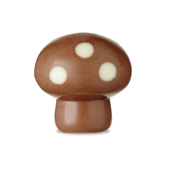 Pralină Ciupercuță Caramel Hazelnuts în formă de ciupercuță din ciocolata cu lapte cu buline din ciocolată cu albă, umplută cu o cremă mătăsoasă de caramel cu alune de pădure caramelizate