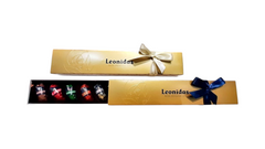 Rigletă elegantă cu un mix de 9 praline Leonidas din ciocolată neagră cu lichioruri pure, în mai multe variante: Amaretto, Cointreau, Limoncello, Curaçao, Poire Williams, Gin, Saint James și Whisky