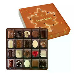 Zanzibar Toamna Leonidas conține o selecție de 16 praline asortate, inclusiv praline de toamnă, în cutie cu sleeve tematic, culoare maro, cadou elegant