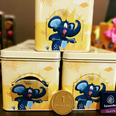 Cutie cadou pentru copii, cu ușiță și design cu animale din junglă prin care ies praline Leonidas, de calitate superioară, ciocolată belgiană, din ingrediente proaspete, fără coloranți artificiali