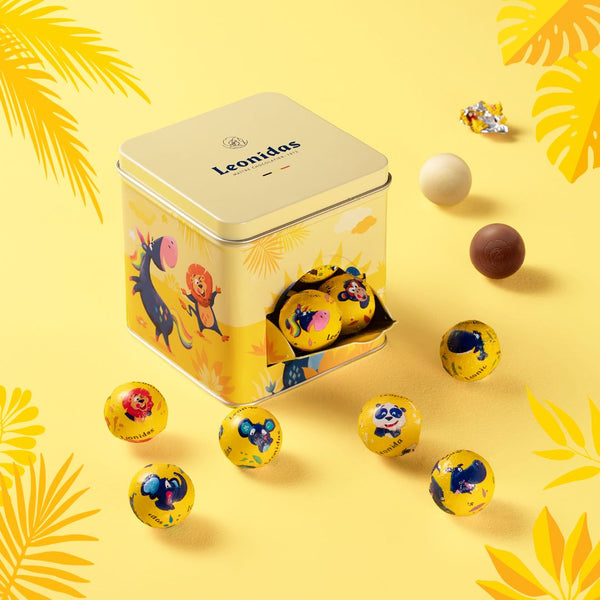Cutie cadou pentru copii, cu ușiță și design cu animale din junglă prin care ies praline Leonidas, de calitate superioară, ciocolată belgiană, din ingrediente proaspete, fără coloranți artificiali